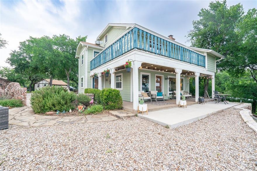 A Rare Lakefront Retreat on Lake Worth, 20 MIN. NW of Down Town Fort Worth. Texas Farmhouse charm meets lakeside coastal cottage in this 2-story retreat with covered porches on both levels, an expressive teal balcony, and a sage green facade that feels as natural on this elevated lot as the live oaks surrounding it. Sweeping 180-degree panoramic views stretch across Lake Worth to the Downtown Fort Worth skyline and beyond, a perspective most people only experience on vacation. This private, elevated retreat sits on nearly an acre with 187 feet of lakefront, personal path to the water, and a covered 30x30 floating aluminum dock which includes a 10x26 boat slip powered by a approx. 6600lb+ HydroHoist lift. 
Lake Worth holds a constant water level with a maximum 5-foot variance — a rare designation that sets it apart from every surrounding lake and protects your investment year-round.  The lot itself is a canvas. Envision a guest ADU, a second residence, or an infinity pool perched above the water. Historic brick fencing, a charming storage structure, and a circular walking path give the grounds a park-like feel with genuine privacy. The detached 2-car garage includes a separate exterior-access storage room ideal for all sorts of items from lake gear to a workshop, and beyond. 

Inside, the home has been comprehensively updated: all-new double-pane windows with a grand picture window framing the lake, dual-zone HVAC with warranty, HardiePlank siding with Tyvek underlayment, updated electrical panel, new guest bath, custom roller shades, and fresh carpet throughout the bedrooms. Overhead utility lines have been buried to preserve the unobstructed views. City sewer and water, whole-home water softener, and reverse osmosis at the kitchen sink complete the package.

Proven as a luxury mid-term rental or move-in ready as a primary residence. Properties combining this acreage, elevation, lakefront footage and floating dock access are exceptionally rare in this market.
