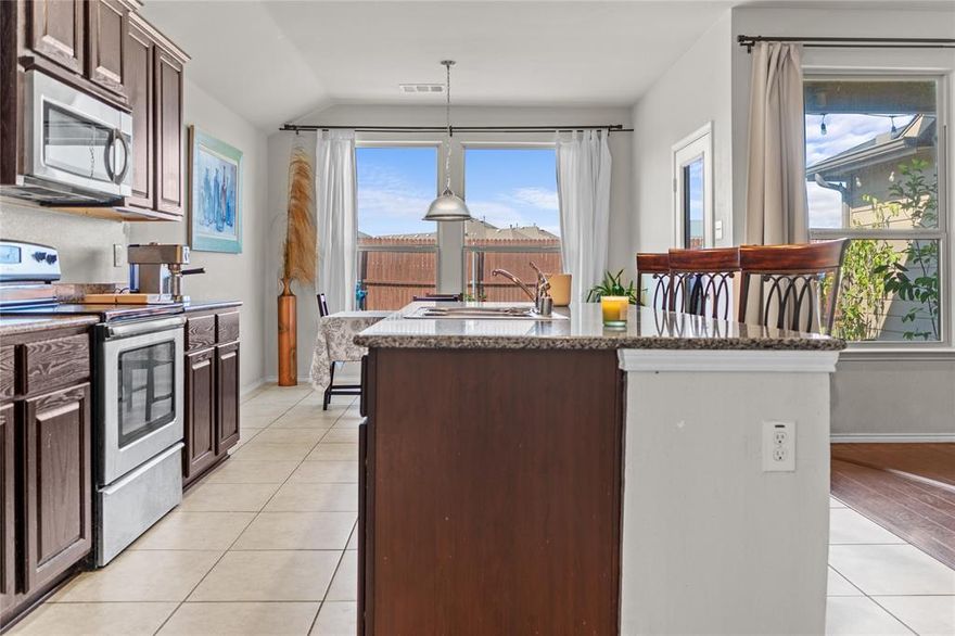 New Roof Installed July 2025. Welcome to this wonderful 4 bedroom home that has been lovingly cared for. Step inside to a wide hallway that leads you to two bedrooms on the left with a full bath nearby. Down the hall you will find a third bedroom with its own private bathroom, perfect for family or guests.
The formal dining room is ready for gatherings, while the open kitchen features an island with a sink and dishwasher, plus a light filled breakfast area. The spacious living room is centered around a cozy wood burning fireplace, creating the perfect place to relax.
The primary bedroom offers large windows that fill the space with natural light along with an ensuite bathroom that includes a soaking tub, separate shower, and a generous closet.
Outdoors, enjoy an extended patio designed for entertaining. The lot offers extra space on the side and behind the fence you will find open land with no back neighbors for added privacy. So many new business coming to Forney. Costco will be very close to this home.  All information deemed reliable but must be verified by agent and buyer.
Come see this beautiful home today and imagine making it your own.