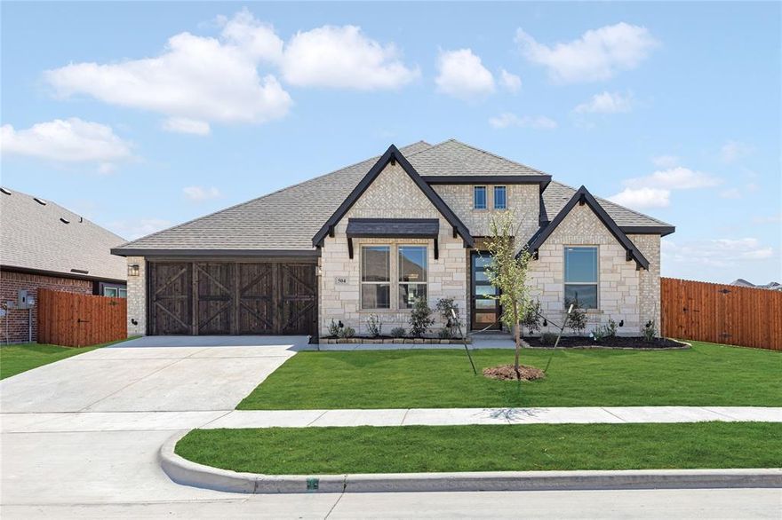 *Special financing available — ask for details!* NEW! NEVER LIVED IN. Ready Now! Bloomfield Homes Caraway plan featuring 3 bedrooms, 3 baths, and a deep 2-car garage in North Grove. A covered front porch and 8-foot front door create a welcoming entry, while the matching covered patio out back adds space to enjoy the outdoors. Wood flooring carries through the main living areas and leads into a spacious family room where a floor-to-ceiling stone fireplace adds a bold focal point. The layout keeps everything connected, with the family room opening to the dining area and a deluxe kitchen equipped with quartz countertops, built-in stainless steel appliances, a apron-front farmhouse sink, pot filler, and plenty of cabinet and prep space for everyday use or hosting. A dedicated media room adds flexibility for movie nights, game days, or a second living space. The primary suite is positioned for privacy and includes an extended shower with additional showerhead, dual sinks, and a large walk-in closet. There are 2 secondary bedrooms, including one with its own ensuite bath and walk-in closet. A mud room with built-in cabinets and a nearby utility space helps keep daily routines organized. You’ll also find front yard landscaping with stone edging, a Christmas light package, comfort-height toilets, and 5-inch baseboards throughout the home. Residents of North Grove enjoy community amenities including a pool, playground, park, community center, basketball court, splash park, open pavilion with restrooms, and trails. Visit or call the Bloomfield Homes model in North Grove to learn more about this Caraway home.