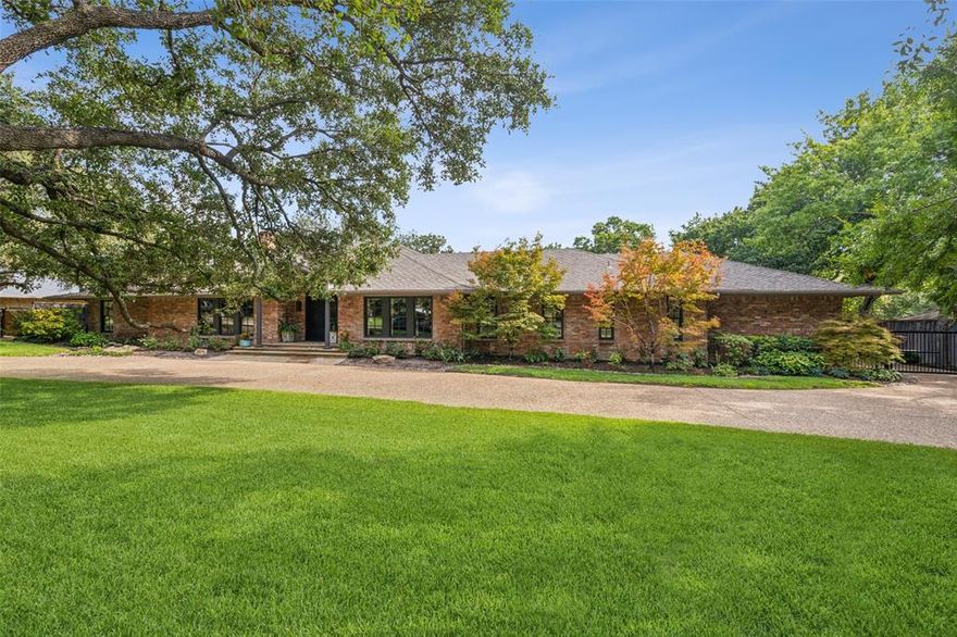 Located in sought after Russwood Acres, this beautifully designed residence features 4 spacious bedrooms, 4.5 bathrooms, providing ample room for comfort and relaxation. Step inside to discover a grand foyer that sets the tone for the elegance found throughout. The home boasts high ceilings, crown moldings, and built-ins, creating an inviting and sophisticated atmosphere. The formal dining room is perfect for hosting dinner parties, while the primary suite offers a serene retreat with a spa-inspired bath featuring separate vanities, a soaking tub, and heated flooring. The chef's kitchen is a culinary haven, complete with 6 burner gas range and griddle, oversized island, and quartz countertops. Relax by the fireplace or enjoy the outdoors in your private backyard oasis, including pool, hot tub, and outdoor kitchen and living area. The back porch offers a charming spot to unwind and enjoy the surroundings. 3-car oversized heated and cooled garage provides ample storage, parking options.