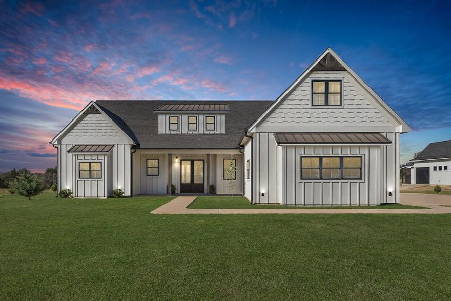 Experience refined country living at its finest with this exceptional estate, gracefully situated on two pristine acres just minutes from Sulphur Springs and the Country Club. Impeccably maintained and thoughtfully designed, this residence offers a rare combination of sophistication, comfort, and timeless style.

The interior showcases an expansive and beautifully curated layout featuring four bedrooms and three and a half baths. At the heart of the home, the grand living space flows seamlessly into a chef-inspired kitchen designed to impress even the most discerning culinary enthusiast. A commercial-grade gas range, exquisite marble countertops, an oversized island, and a charming coffee bar with a secondary sink create a space that is both functional and striking.

The primary suite is a private sanctuary, offering a spa-like bath retreat complete with dual vanities, an elegant sleigh soaking tub, a separate glass-enclosed shower, and a custom walk-in closet designed for effortless organization. The main level also features a dedicated office, an oversized laundry room, a generous walk-in pantry, a stylish guest half bath, and an attached garage.

Upstairs, the home continues to captivate with a spacious second living area, an additional primary suite, and two well-appointed guest bedrooms connected by a beautifully designed hall bath. Each bedroom offers walk-in closets, ensuring both luxury and practicality.

Outdoor living is equally compelling, with expansive covered porches that invite relaxation and entertaining amid peaceful surroundings. The rear porch is enhanced with an outdoor sink, adding convenience to outdoor gatherings. A detached garage with additional storage and an attached dog kennel further elevates the property’s versatility.

Offering privacy, elegance, and modern comfort in a serene setting, this remarkable property presents an extraordinary opportunity to embrace a lifestyle of quiet luxury.