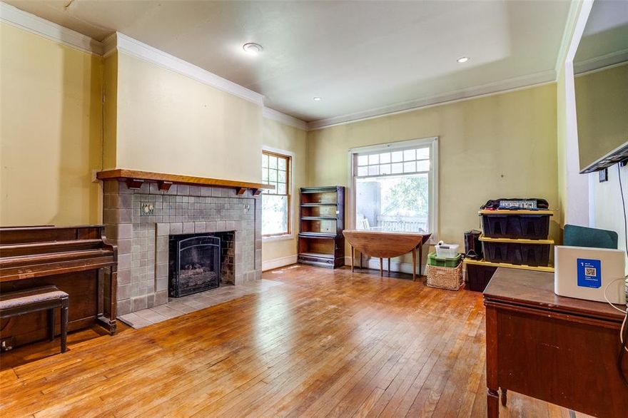 I'm excited to share a truly special property located in Munger Place, one of Dallas's best-kept secrets. This charming historic neighborhood offers an incredible blend of community pride, active involvement, and fantastic proximity to Downtown Dallas.This home presents a unique opportunity to transform an older residence into your personalized dream house. You'll find beautiful hardwood floors throughout, along with spacious front and back porches, perfect for entertaining and enjoying the upcoming fall weather. It appears the existing fireplace tile might be Rookwood, which is a truly timeless and highly regarded material. Given its classic appeal and the fact that it often serves as a significant focal point in a room, you may want to consider this potential historical value before making any changes.The property also features guest quarters with convenient alley access, providing a flexible space for your creative ideas to meet your specific needs. Additionally, a workshop one on the first floor and bonus room on the third floor offer even more possibilities. Don't miss out on this exceptional chance to own a piece of Dallas history.