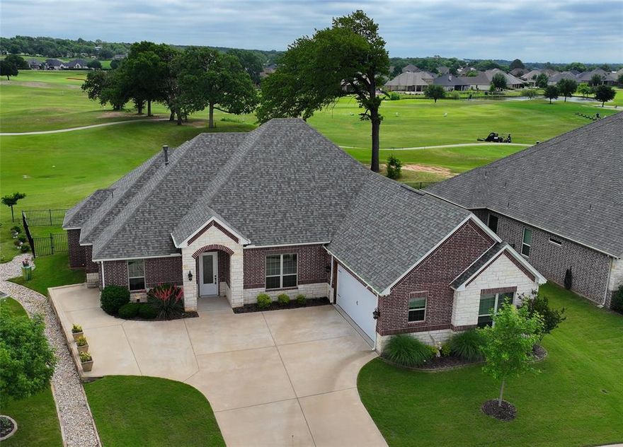 Situated along the golf course in Harbor Lakes, this very attractive and lovingly maintained home offers a comfortable and inviting open concept layout with thoughtful features throughout. The living room , dining room and kitchen all enjoy a wall of windows overlooking the Harbor Lakes Golf Course taking full advantage of the lush landscaping of this championship course. The open concept is also ideal for daily living and casual gatherings. The kitchen features granite counters, a gas cook-top, double ovens, walk in pantry, a large center island, and a separate breakfast bar. The split-bedroom floor plan provides a sense of privacy, with the primary suite located apart from the secondary bedrooms. The primary bedroom is generously sized and includes a well-appointed en-suite bath with double vanities, a seated vanity area, large luxurious walk in shower and the bench seat hides all of the plumbing should you decide you want to add a bathtub sometime in the future. Don't miss the oversized walk-in closet that connects directly to the laundry room. A dedicated office with double glass-pane doors and a closet provides a flexible space for working from home, a home library or even a guest room for overflow guests. The large covered back porch is fully screened and offers a relaxing spot to enjoy the view in a comfortable, insect free setting.  Walk to the Harbor Lakes Country for fine dining and social activities or jump in the golf cart for a quick 18 holes. A new roof was installed in 2025, and the property includes a 2-car garage along with a dedicated golf cart garage.   (membership to Harbor Lakes is optional, not included in HOA) .