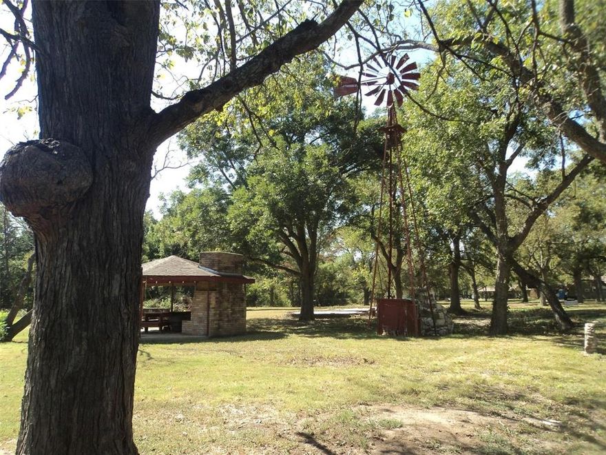 Escape to your own private retreat on this breathtaking nearly 3-acre lot, enveloped by majestic shade trees, mature pecan trees and offering a tranquil sanctuary away from the hustle and bustle of city life. Situated on a paved road less than 10 minutes from downtown Bonham, the Fannin County seat, and right off of Hwy 121, this stunning parcel of land presents an exceptional opportunity to build your dream home.  With a water meter already in place, the groundwork is laid for effortless utility access, simplifying the building process. Conveniently located just minutes between Leonard and Bonham, you'll enjoy easy access to a variety of amenities, including shopping, dining, and entertainment options. Whether you're seeking a weekend getaway or year-round residence, this exceptional property offers the perfect blend of rural tranquility and urban convenience.