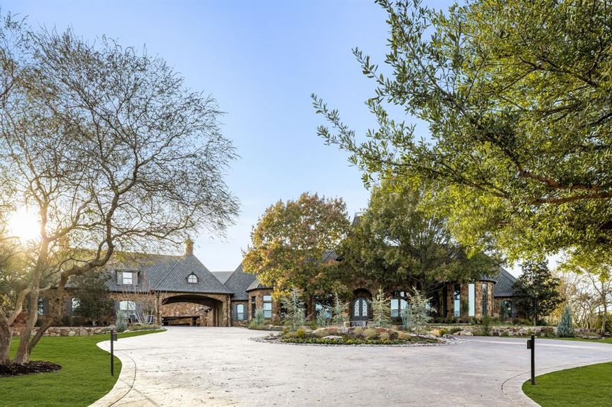 Privately gated and set on three acres, this French-inspired estate offers refined architectural elegance, resort-style living, and modern self-sufficiency. The property has undergone a comprehensive $3MM+ renovation and is impeccably maintained, delivering true turnkey luxury. Features include a private well, whole-house generator, and new HVAC systems throughout every structure.

The 8,289-square-foot main residence is designed for mostly single-story living with light-filled interiors, custom millwork, curated lighting, and timeless finishes. The chef’s kitchen is appointed with professional-grade Viking appliances, bespoke cabinetry, crystal lighting, and a built-in Miele coffee system. A climate-controlled wine room enhances entertaining. The primary suite features heated flooring in the bath, a private sauna, and an in-suite coffee bar with a second built-in Miele coffee system.

The layout includes two bedrooms on the main level and two upstairs, each with its own ensuite bath. Additional spaces include a gym, flexible lifestyle areas, a top-of-the-line home theater, and a safe room.

A finished two-story guest house totals 1,237.44 square feet and includes a full kitchen, living room, two bedrooms, and bath. Outdoor living features climate-controlled loggias, screened patios, and a resort-style pool with slide and waterfall grotto. The seven-car, climate-controlled garage includes 967 square feet of finished, conditioned flex space above. The three-acre setting allows room for a future sport court or additional structure. Total heated and cooled living space across the estate is 10,493.44 square feet.