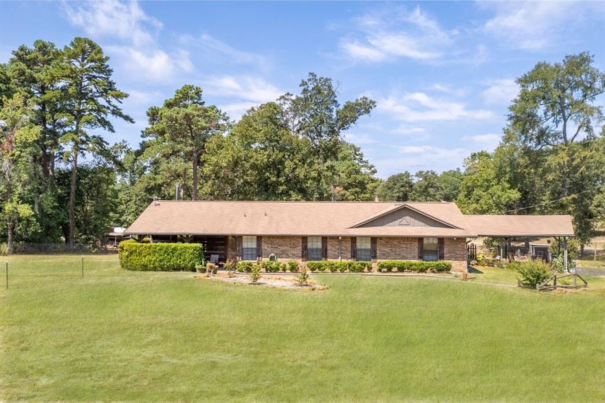 Set on 3.44 peaceful, wooded acres, this beautifully maintained single level home offers the perfect blend of comfort, charm, and country living with a brand new roof to be installed prior to closing for added peace of mind. Inside, you'll find three inviting bedrooms and two full baths with shower and tub combos, thoughtfully designed for easy everyday living. Vaulted ceilings and cozy wood-burning stove anchor the living room, creating a warm, open space that's perfect for unwinding after a day in the saddle. A flexible game room adds bonus space ideal for home office, hobby room, or creative studio. The split primary suite offers privacy and features a generous walk-in closet with plenty of room for boots, tack, and more. Utility room with a sink adds everyday convenience. For the horse lover, this property truly shines. Fully fenced with no climb horse fencing, the land is both functional and beautifully landscaped. The Equestrian amenities are already in place! Two horse stalls, a tack room, hay shed, and two additional storage sheds making this a turnkey setup for your horses and equipment! Ideally located near Lake Palestine and within the highly regarded Owens, Three Lakes, and Tyler Legacy school districts, this property offers peaceful country living without sacrificing convenience.