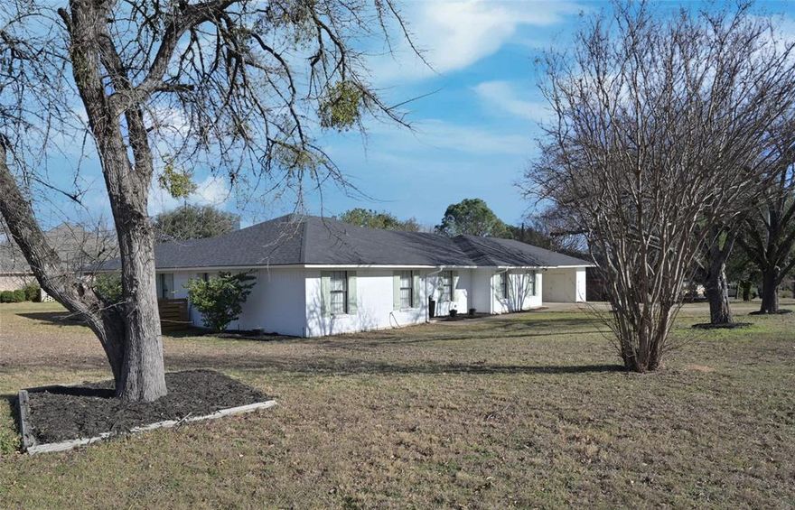 Location! Location! Beautiful custom built 2,164 sq. ft. Granbury Home loaded with charm and modern updates on large corner lot in the prestigious DeCordova Estates!! Just blocks from the Community gated, 24 hour Guard Station with cabana, golf, tennis, pickleball, volleyball, basketball, clubhouse, dining, marina and fitness center just minutes away! Rear Golf Cart Garage and New Roof in 2025! Luxurious, thoughtfully updated floorplan with luxury vinyl plank and tile floors, recessed and accent lighting, ceiling fans and neutral colors throughout. Large Chef's Kitchen in the heart of the home with an abundance of cabinets, complete with pull handles, stainless steel appliances, tiled backsplash, smooth top electric cooktop, separate oven, built-in microwave and dishwasher. Over sized Laundry with numerous storage cabinets and space for freezer, folding table or wine cooler. Bright Dining area with double glass doors open to a large 25x13 covered back patio, perfect for cook outs, guest or family gatherings. Spacious Family Room with corner brick W-B fireplace and front Bonus Room with wide double stained barn doors, opens to an Office and 2nd Living, optional 2nd Dining, Game room, work out room or Children's Retreat. Large private Owner's Suite with updated bath, two separate vanities, side make-up vanity and two walk-in closets. Side 20x23 covered parking with multiple built-in storage cabinets, and an expanded driveway, perfect for 3rd car or truck. Huge wood and wrought iron fenced backyard, large storage building and much more! Schedule your showing today to see this spotless, beautifully updated home with endless possibilities!