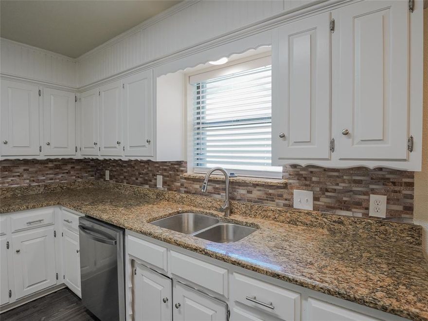 Fully remodeled and hitting the market for the first time! This gorgeous 4 bedroom, 2 bathroom home has been completely remodeled and is move in ready! In the kitchen you'll find granite countertops and new appliances. Take your pick between relaxing in front of the large fireplace in the living room or hanging out in the oversized sunroom with easy access to the fenced backyard. Down the hall you'll find bedrooms with fresh carpet and nice sized closets and updated bathrooms.