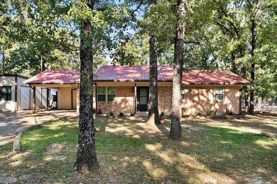 A one-of-a-kind property this 3 bedroom 2 bath well kept brick home sits back from the road on 7.58 acres. There is pipe fencing across the front with smooth wire fencing sides and rear.  Many beautiful oak trees and sandy soil.  This home has been renovated from top to bottom, floor coverings, paint, and bathrooms with a kitchen that would make a chef happy.  It has a pantry (9x18) with wire shelving and room for a refrigerator or freezer.  There is a 38x30 ft shop and several other multipurpose buildings.  Bring your most discerning buyer who loves the country and wants room to roam.  Cattle and horses allowed.