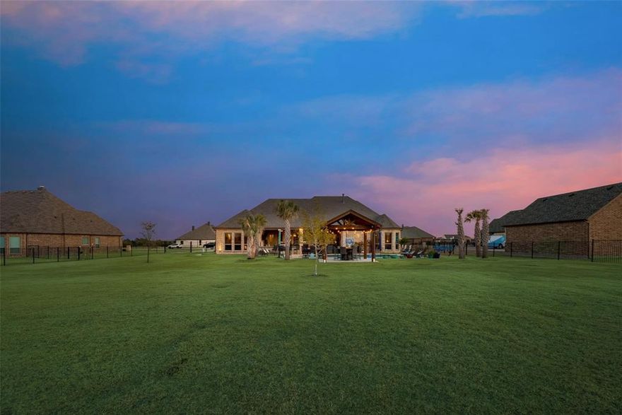 Motivated Seller’s bring all offers for this  little bit Country and a little bit City home. An Incredible Opportunity in Desirable Layden Farms! Don’t miss the chance to own this custom-built Nexus home on acreage in the sought-after Layden Farms community, offering quick access to the highway and the perfect blend of luxury and comfort. This stunning home features an open-concept layout designed for entertaining. The chef’s kitchen boasts beautiful knotty alder cabinetry, elegant countertops, a stylish backsplash, and a large 8-foot island overlooking the living area. You’ll love the high-end appliances, butler’s pantry, and oversized walk-in pantry—a true heart of the home.The living room offers a cozy atmosphere with a gas fireplace and hardwood floors throughout the main living spaces.
The spacious primary suite features a sitting area and serene views of the backyard pool. The luxurious en-suite bathroom includes a large walk-in shower, double vanities, and a high window that fills the space with natural light.A flexible gameroom currently serves as a second primary suite, allowing you to adapt the home to your needs.At the front of the home, you’ll find two additional bedrooms connected by a Jack and Jill bath, while another bedroom and full bath sit on the opposite side of the home—ideal for guests or multigenerational living. The office with French doors can also function as a fifth bedroom. Every bedroom includes a walk-in closet for ample storage. Step outside to your private backyard oasis—complete with a sparkling pool featuring swim-up table seating, covered patio, pergola, and a fully equipped outdoor kitchen with a built-in bar, grill, refrigerator, and sink , wired for sound and tv.  It’s the perfect space for gatherings or relaxing evenings enjoying breathtaking sunsets.This home is energy-efficient with foam insulation and ready to welcome you just in time for the holidays!