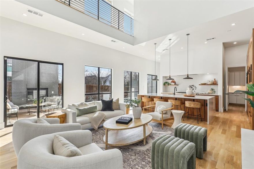 Welcome to the pinnacle of Knox Henderson luxury living, where mid-century contemporary design meets modern elegance in a seamless blend of form and function. This architectural masterpiece, designed by Parmadesigns and expertly built by Strange & Sons, offers a warm, organic feel with meticulous attention to detail and high-end finishes throughout. The thoughtfully designed open floor plan allows natural light to flood every corner, accentuating the stunning brick masonry fireplace, a sophisticated built-in bar, and an elegant dining area that flows effortlessly into the living space. The chef’s kitchen is a true showpiece, featuring custom high-end cabinetry, a hidden refrigerator, and a scullery for added functionality, creating an effortless balance of beauty and practicality.  Step outside to a tranquil backyard retreat, where a covered sitting area with a built-in grill overlooks the shimmering pool, offering the perfect setting for relaxation or entertaining. Ascend the two-level deck, where breathtaking, unobstructed views of the downtown skyline provide an unforgettable backdrop for hosting guests or enjoying a quiet evening under the stars. The primary suite is a sanctuary of comfort, boasting soaring vaulted wood plank ceilings, an opulent en-suite with separate vanities, a walk-in shower, and a luxurious soaking tub, creating a spa-like retreat. Every space in this home is adorned with gorgeous designer tile and hand-selected fixtures, adding to its distinctive character and refined elegance. Perfectly positioned in one of Dallas’ most sought-after neighborhoods, this home embodies sophistication, modern luxury, and timeless style. Don’t miss your opportunity to experience the finest in contemporary living—schedule your private showing today.