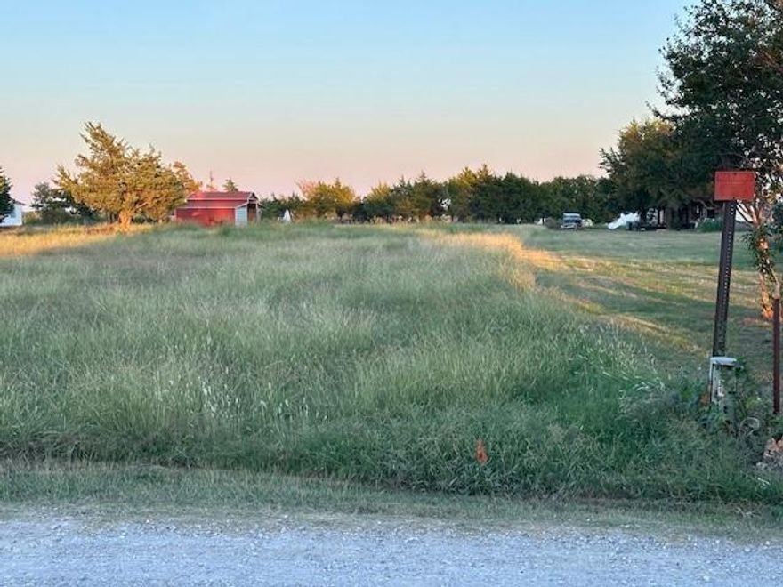Must see property 2 acres of flat land with just a few trees. Utilities are at the road, red barn that can be used or taken down. No-non restrictions. More land for sale next to the 2 acres.