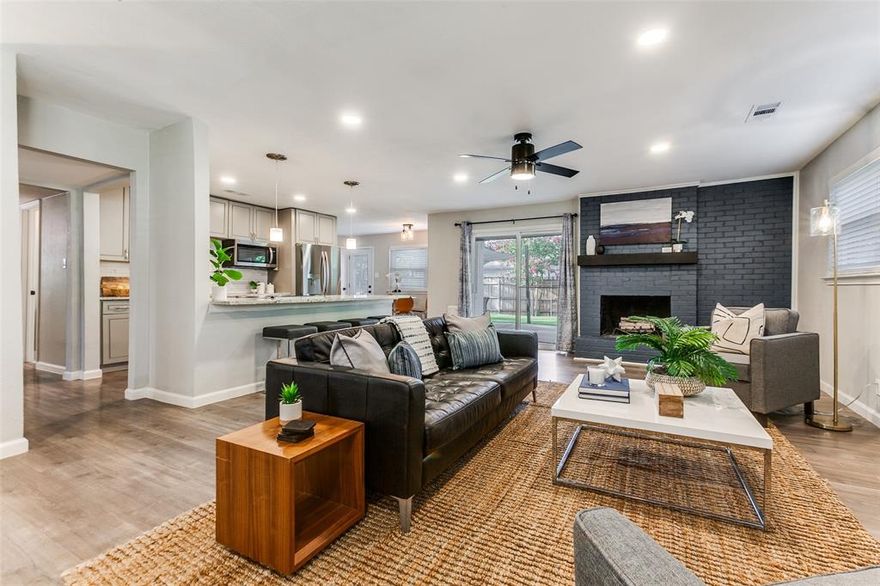 A beautifully remodeled 3-bedroom, 2-bathroom mid-century home with tall, mature trees on a large corner lot less than two miles from I-35E and I-635. This home has a spacious open floor plan with LVP flooring, a stunning fireplace, and high-end ceiling fans. It features a new kitchen with granite countertops and peninsula, stainless steel appliances, custom cabinets, and a white stone backsplash. Each bathroom has been updated with gorgeous tile, granite, and new cabinets and fixtures. The master bathroom includes a double vanity, designer tile, and oversized glass shower with rainfall showerhead. The home is also fully updated with a new roof (2021), HVAC system and smart thermostat (2024), water heater (2021), smart locks (2025), smart garage door opener, custom closets, and full Ring security system . Outside, you’ll find a beautifully landscaped and fenced backyard with an inviting outdoor patio - perfect for relaxing or entertaining.