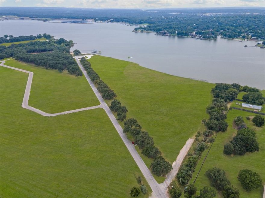 Discover Lot 3 at Waterfront on Park — a rare 1.64-acre homesite in an exclusive community on the tranquil, south-facing shores of Eagle Mountain Lake. Once a beloved city park, this private enclave now features just 16 premium lots with direct lake access for swimming, boating, and fishing, and breathtaking water views. Enjoy the serenity of lakeside living just minutes from vibrant downtown Fort Worth. This is your opportunity to create a custom retreat in a setting where nature, privacy, and convenience converge.