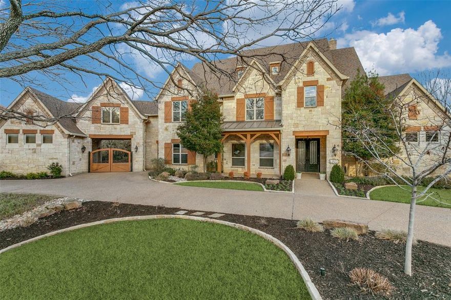 Discover a rare opportunity to own a magnificent estate on a sprawling 1¼-acre lot, backing to protected Army Corps of Engineers land for ultimate privacy & serene wooded views. This exquisite retreat offers the perfect blend of luxury and tranquility, just minutes from the vibrant energy of Southlake’s shopping, dining, and activities. Step inside to a grand Great Room, where a wall of windows showcases breathtaking views of the resort-style pool & lush landscape. The gourmet kitchen is a chef’s dream, featuring Wolf & Sub-Zero appliances, a warming drawer, dual dishwashers, & an oversized island—perfect for entertaining. The lavish first-floor primary suite is a true sanctuary, complete with a private sitting area, spa-like bathroom, & an expansive walk-in closet designed for the most discerning fashion enthusiast. A private guest suite on the first floor offers its own ensuite bath & custom walk-in closet, ensuring comfort & privacy for visitors. Upstairs, an entertainer’s haven awaits, offering a media room, three flexible spaces ideal for hobbies or work, & two generously sized bedrooms with ensuite bathrooms & private lofts. Designed for modern living, this estate is equipped with a state-of-the-art smart home system, providing effortless convenience & security. Don’t miss this one-of-a-kind estate—a peaceful country retreat with unmatched access to Southlake’s premier amenities.