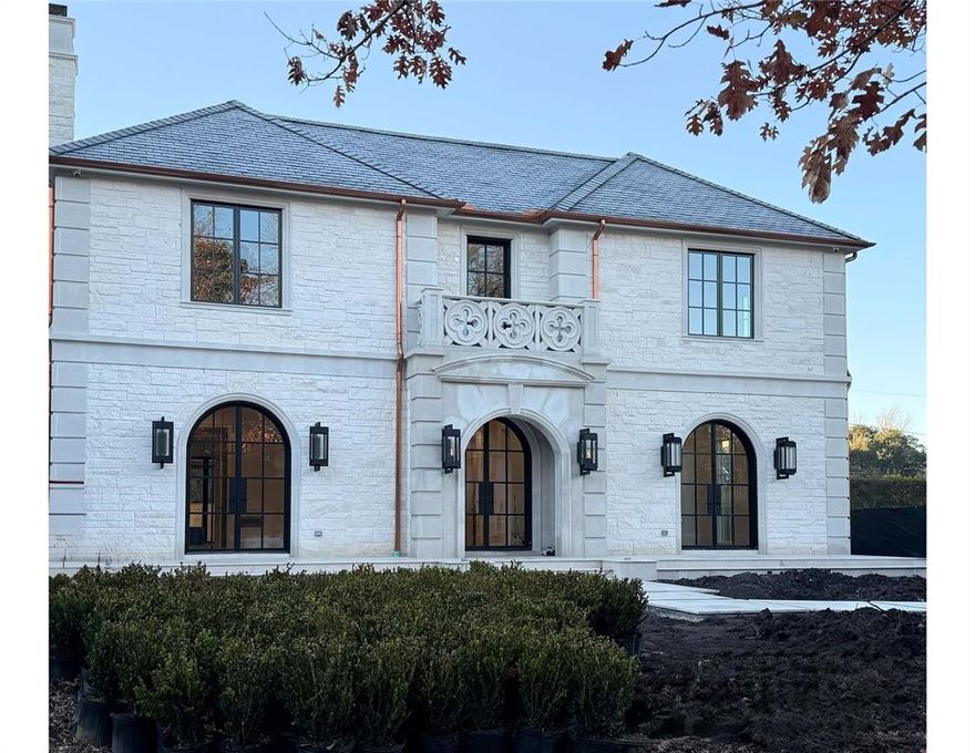 Introducing a remarkable new build on a spacious 70x160 lot in the heart of University Park, a short stroll to UP Elementary and Caruth Park. Crafted by renowned builder Colby Craig Homes & architect Richard Drummond Davis, this stunning residence offers 5 bedrooms with 5.3 baths across an expansive 7,025 square feet, showcasing an unparalleled level of craftsmanship and meticulous attention to detail, highlighted by custom millwork, museum finished walls, natural oak flooring and designer finishes throughout. The French Transitional facade boasts a striking combination of clean white Austin stone with cast stone accents, copper gutters, a Samaca slate tile roof, Bevolo gas lanterns, Lincoln windows, and elegant iron and glass front doors. The main floor is thoughtfully designed for entertaining, featuring formal living spaces, a wet bar, and an expansive great room that opens to a gourmet kitchen with Taj Mahal quartzite, a waterfall island, 60-inch Wolf range with a bold vent hood, dual dishwashers, a steam oven, and Sub-zero refrigeration and wine columns. Upstairs, you will discover five bedrooms, each with its own ensuite bath, along with a generously sized game room complete with built-in bunk beds. The primary suite features heated marble flooring, a steam shower, dual wash-lets, and dream closet with custom lighting. Outside enjoy over 350 sf of covered patio space equipped with a summer kitchen, fireplace, pool bath, remote-controlled shades, ceiling-mounted heaters, and a resort-style pool with spa surrounded by lush, low-maintenance turf. Additional details include 11-foot ceilings, an elevator, Toto toilets, office, Emtek hardware, Brizo faucets, a whole-home HVAC scent system, and Lutron lighting.  March 2026 Completion.