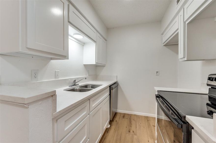 What you've been waiting for, welcome home to this one bedroom renovated condo off of Cedar Springs Road and popular Oaklawn area. This Landmark River Oaks Community has beautiful grounds & backs up to a greenbelt and creek. Updates include new paint, new LVP flooring throughout,  & new kitchen appliances. The Beautiful kitchen features white cabinetry & neutral quartz countertops, ready to compliment your unique home decor. You will love the tastefully remodeled bathroom, an extra & separate vanity area, and big walk-in closet. Enjoy the natural light coming into the living room as well as the bedroom. Your covered balcony is right off the living room, and overlooks the pool area. Live amidst the vibrant greenery with surrounding large mature trees & the lush greenbelt and creek. This community offers several convenient gated parking options including underground covered parking. Prime location next to Oak Lawn and the vibrant Cedar Springs strip, just minutes from Downtown & Uptown with easy access to the best restaurants, shopping, and nightlife. Minutes from Love Field airport & the Medical District. See it and love it!