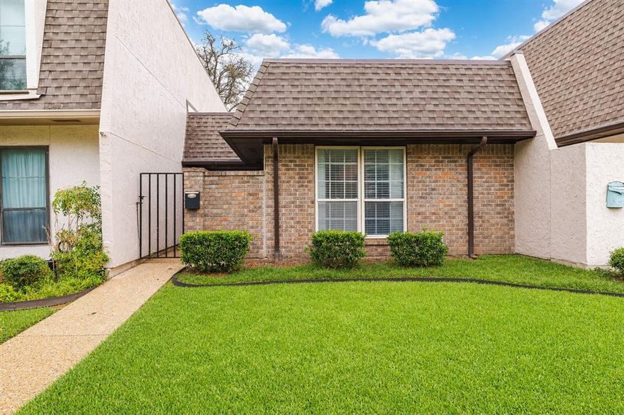 Welcome to this charming single-story townhome, offering a blend of comfort and modern elegance. Located in a desirable, gated community, this residence features a delightful gated porch, perfect for relaxing outdoors in your own privacy. Step inside to discover beautiful wood-style flooring that extends throughout the common areas, adding a touch of sophistication and warmth. The inviting living room boasts a classic wood-burning fireplace, ideal for cozy evenings and built-in shelving provides both functionality and style. The kitchen is a chef’s dream, equipped with sleek SS appliances and an abundance of cabinet space to keep your culinary essentials organized. The bedrooms are thoughtfully designed with plush carpeting for a cozy, restful retreat. Additional highlights include covered parking with convenient storage. This townhome combines practical features with stylish finishes, offering a perfect blend of comfort and convenience. Residents also enjoy fantastic community amenities, including access to a sparkling swimming pool, tennis courts, and a dedicated dog park, perfect for staying active and giving your four-legged friends room to play.