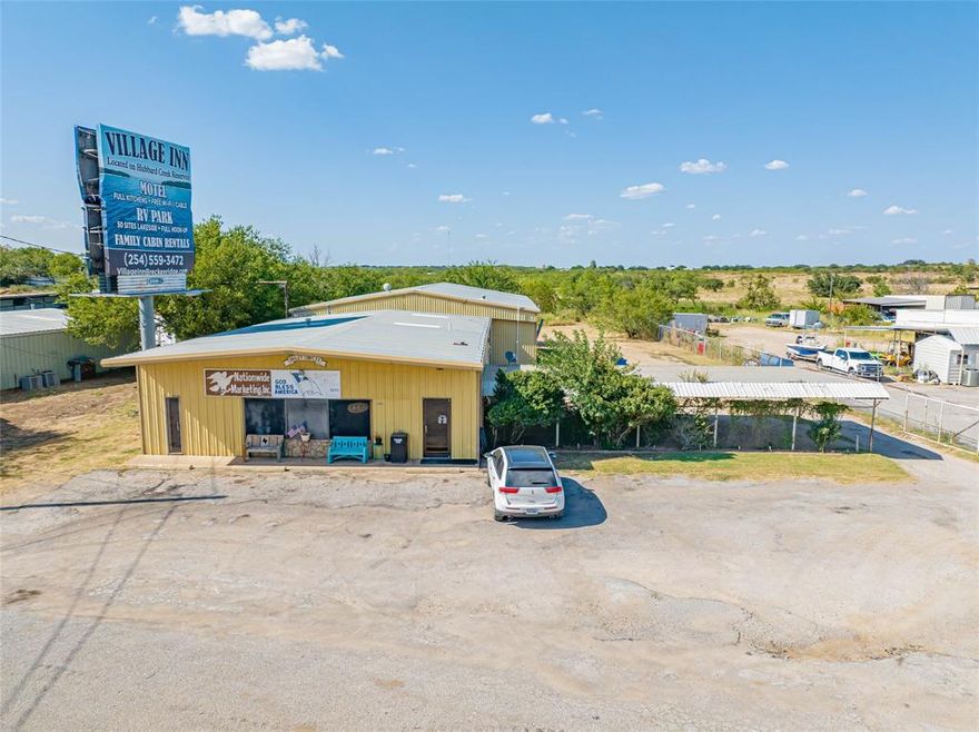 If you're planning to start or move your business, this prime location on Highway 180 W is excellent for increasing visibility and ensuring business success. Situated on 1.2 acres, the property includes approximately 2,680 SF of office space, 3,250 SF of warehouse space, and 3,000 SF of open storage, catering to a variety of business needs. The office features a spacious front area with multiple offices in the back, his and her bathrooms, and a kitchenette, all serviced by 2 HVAC units. The warehouse has a large roll-up door, an additional sliding door for large equipment, and two offices in the loft; it's insulated and heated with a wood-burning fireplace. The open storage unit at the rear of the property was previously used for boat and car storage. For added security, the entire property is surrounded by a tall pipe fence. This opportunity is ideal for expanding or launching your enterprise in a location designed for visibility and growth. Seller is willing to lease. Call for terms.