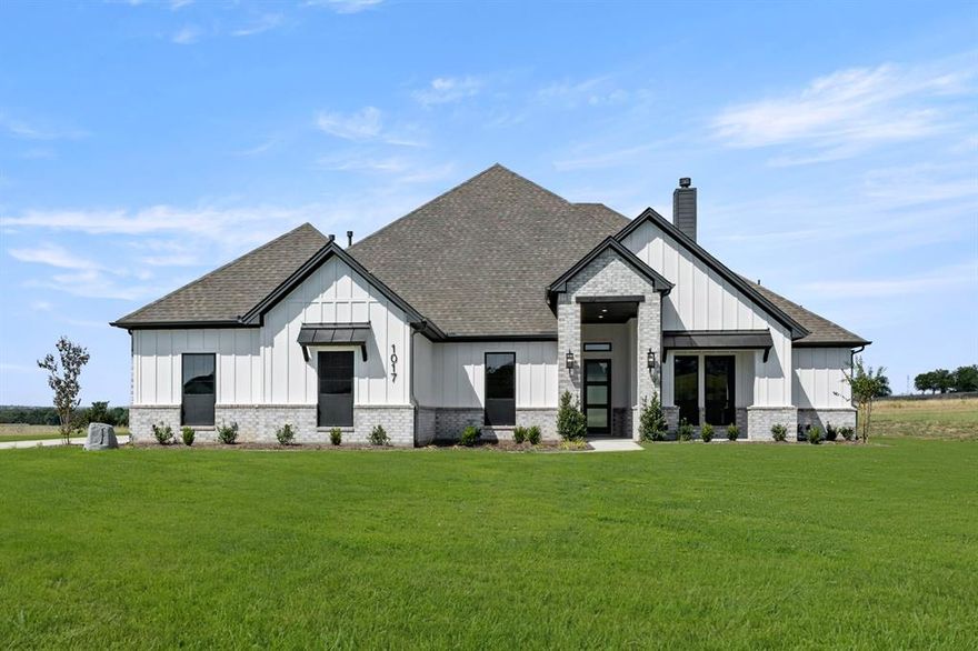 MLS# 20849252 - Built by Brookson Builders - Ready Now! ~ Please ask about our $40,000 Brookson Bucks allowance! This upcoming 4-bedroom, 3.5-bathroom single-family residence, boasting 2809 sqft of spacious living, is set to complete by Summer 2025. Nestled in Prairie Hills Addition, under Aledo ISD, this home is perfect for families. The interior shines with decorative lighting, a kitchen with an island, open floor plan, pantry, and a vaulted ceiling. The exterior features a covered patio, 4-car garage, and ample lighting. This farmhouse elevation on 2 acres is a perfect escape from the hustle and bustle of the city!