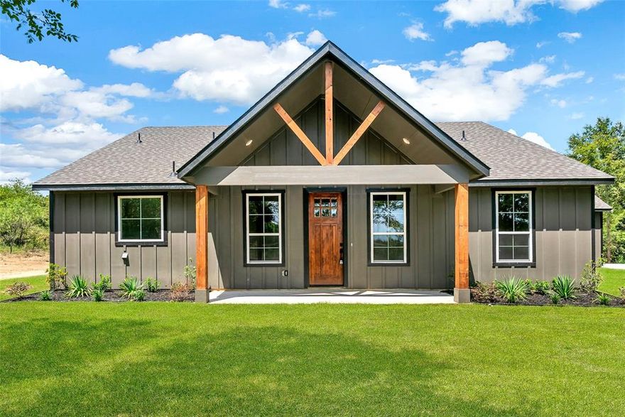 Welcome to this stunning new construction modern farmhouse-style home with barndominium-inspired design in Bristol, offering over 2 acres of peaceful country living just 25 miles from Dallas. Tucked beneath mature trees, this 3-bedroom, 2.5-bath home blends space, privacy, and thoughtful design—creating the perfect balance between quiet surroundings and everyday convenience. Inside, 1,994 square feet of open-concept living features high ceilings, abundant natural light, and custom finishes that feel both warm and elevated. The spacious living area is designed for gathering and connection, while the split-bedroom layout provides a private retreat in the primary suite with secondary bedrooms positioned on the opposite side. A convenient half bath for guests and a large laundry room with direct access to the primary closet add to the home’s functional appeal. Step outside and imagine mornings with coffee under the trees, afternoons spent enjoying your acreage, and evenings unwinding under wide-open Texas skies—whether hosting, relaxing, or simply taking in the quiet. Located in Ferris ISD and near the scenic bluebonnet trails, Sugar Ridge Winery, and Bristol General Store, with easy access to the historic downtowns of Ennis and Waxahachie, this home offers a rare opportunity to enjoy modern country living without sacrificing proximity to the city. Priced approximately $10,000 below recent appraised value, offering immediate value for the next owner—making it easy to picture your next chapter here.