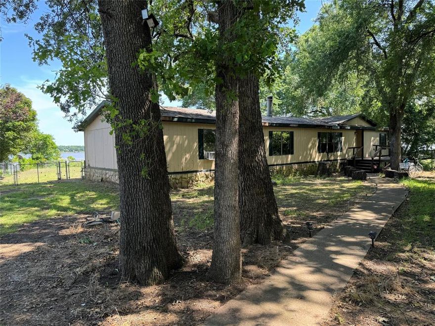 Looking for a beautiful lake view and amazing sunsets from your back porch?! This doublewide home sits on two lots in the Tamarack subdivision with a fenced in above ground pool and lake access right in your backyard. Perfect investment home or a great fixer upper to call your own!