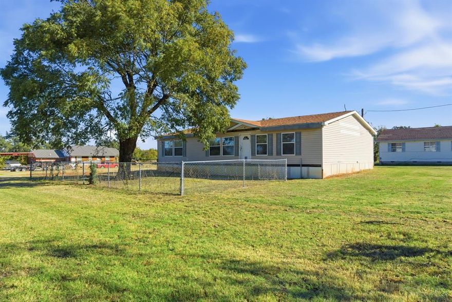 Charming 3-bedroom, 2-bath home on a spacious corner lot in Ranger! This well-kept 1,560 sq ft property offers comfortable living with a great layout, plenty of natural light, and a welcoming country feel.

Step inside to an open living area featuring a beautiful wood-burning fireplace with a stone surround—perfect for cozy nights at home. Large front windows brighten the space and offer pleasant views of the yard.

The kitchen is generously sized and functional, offering abundant cabinet storage, a center island, and ample counter space. With its open design, it’s ideal for cooking, gathering, and everyday living. A dedicated dining space sits conveniently just off the kitchen.

All three bedrooms are well-sized, and the two full baths provide comfortable accommodations for family or guests. The home is move-in ready with clean finishes, and a bright, airy feel throughout.

Outside, enjoy a large fenced yard with plenty of room for pets, gardening, or outdoor activities. The property includes a 2-car carport and sits on a roomy corner lot.

Whether you're looking for a primary residence or a rental property this home offers great value and convenience. Don’t miss this opportunity!