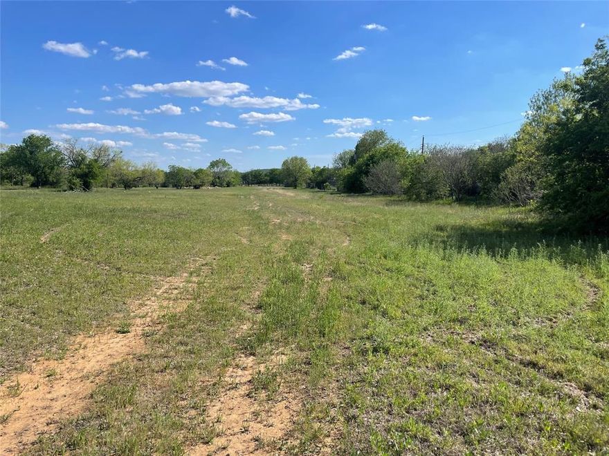 Beautiful 10.634+- acres on Airport Road on the southeast side of town.  This property has a lot of possibilities, with beautiful trees and native pasture land. It is a two-parcel property joined together.  One parcel contains 6.88+- acres and the other paracel contains 3.754+-.   Feels like country living but near the city. It has great potential for building your dream home!
