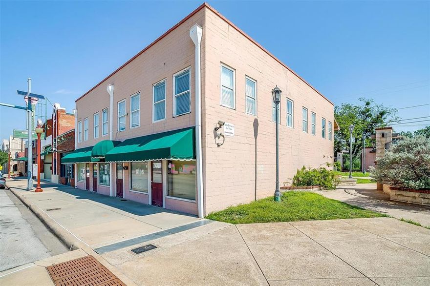 WOW! Location is Prime to bring your business to this Historic Part of Fort Worth, less than a mile from the Fort Worth stockyards with 44 feet of road frontage. Two Stories with a working Elevator as well as stair access to second story. Currently set up with the first floor as reception area with multiple offices and small group rooms. The upstairs includes 10 offices spaces with large common area. 4 Bathrooms total, 2 upstairs and 2 down. Back of the  building has balcony and covered back patio overlooking the back lawn and city owned common area.The possibilities are endless with this space. 2 doors down from the historic Rose Marine Theatre. Rare opportunity to own your own piece of real estate so close to the Historic Stockyards!