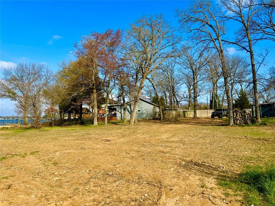 How about a protected open water cove with a view of the Enchanted Islands? This is an exceptional location with the million dollar views, towering trees, deep water where your dock will stand and calm water protected from those big summer white caps! Tucked into the cove protected by Enchanted Isle one of the most popular places to throw an anchor and drift! Beautiful waterfront lot ready for you to build the lake home you’ve always envisioned! Nestled on protected water, this property offers the perfect balance of peaceful views and ideal boating conditions. A new retaining wall is already in place, adding both value and peace of mind. Enjoy deep water at your shoreline perfect for swimming, fishing, and future boat dock plans. Whether you’re dreaming of a weekend retreat or a full-time residence, this prime homesite is a rare opportunity to create your own slice of lakefront paradise. This lot will be getting assigned it's own new address, expected to be 158 Aztec. The home at 160 Aztec is currently being gutted and fully remodeled.