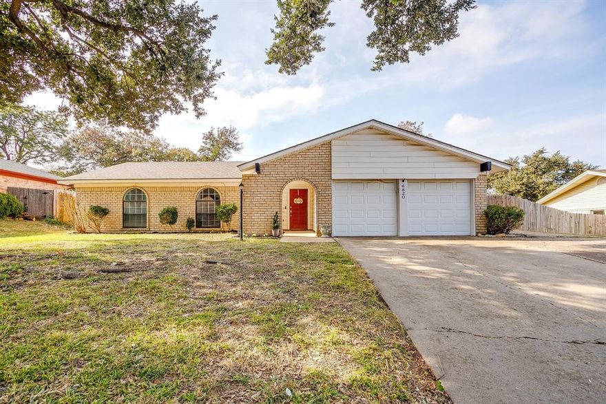 This Wedgwood charmer sits on a quiet street with quick, easy access to the Chisholm Trail Parkway. Inside, the renovated layout opens up the living room and kitchen under vaulted ceilings, wood beams, and a brick arched fireplace that steals the show. Both bathrooms are fully remodeled, and the primary bedroom—along with one secondary bedroom—offers impressively large closets. Out back, a spacious covered patio overlooks a big yard shaded by mature trees, plus a storage shed that frees up your garage for actual parking. In this price range, in Fort Worth, this one is tough to beat.