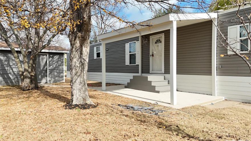 Charming manufactured home located in Cottonwood Park. Home measures 16’ x 68’, offering approximately 1,088 square feet with two bedrooms and two bathrooms. Home is an open floor concept, with a media wall in living room and his and her sinks in primary bathroom. Land included in sale. Situated in a well-maintained community in Wylie, this property includes the singlewide, small storage with electric and a carport. Located in Dallas county, with Garland ISD schools. Owner financing available!! Buyer and buyers agent to verify all information including measurements, schools and utilities.