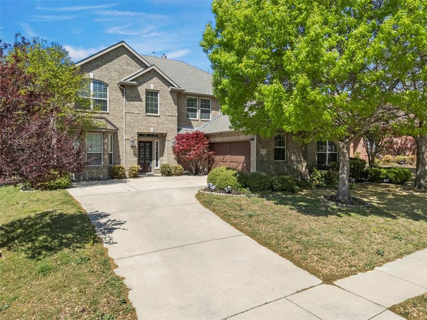 MOTIVATED SELLER-Beautifully maintained Ashton Woods home featuring rich wood flooring and timeless charm throughout the main downstairs living. Elegant iron balusters, tray ceilings, and graceful arches add striking architectural character. Open-concept living creates a seamless flow between the kitchen and living areas, making the space ideal for entertaining and everyday living. The formal dining room provides the perfect setting for gatherings with family and friends. Abundant windows fill the home with natural light, creating a bright and inviting atmosphere. The chef’s style kitchen is designed for both everyday living and entertaining, featuring a gas cooktop, granite countertops, oversized island, dry bar, and convenient butler’s pantry that offers additional storage and prep space. Relax and unwind in the downstairs, primary retreat with a large soaking tub. The spacious laundry room with sink adds everyday convenience. Additional living and entertainment upstairs in the game and media rooms. Also upstairs are 3 additional bedroom and 2 full baths. Step outside to a large, private backyard featuring two covered patios, including one directly off the primary bedroom, creating a peaceful outdoor retreat. Ideally located close to shopping, dining, and entertainment, with no homes directly behind, providing added privacy. Seller to condsider up to $6k in concessions for updates.