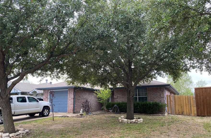 This home is nestled in the sweetest, very quiet, peaceful neighborhood in Dallas. This 3-bedroom, 2 bath home features a large living space with tile flooring throughout, NO carpet. The primary room offers a very spacious main and bathroom with a dual sink vanity while two additional bedrooms provide comfort and versatility. Exterior also features a huge Carport-Covered patio, with a huge backyard and a new fenced perfect for family reunions.  This home is conveniently located just minutes from Downtown Dallas, plus access to shopping, parks, schools, and restaurants, making it an ideal location for families. Come see it! This gem will not last long. Home qualifies for Cash, Conv, FHA, VA.