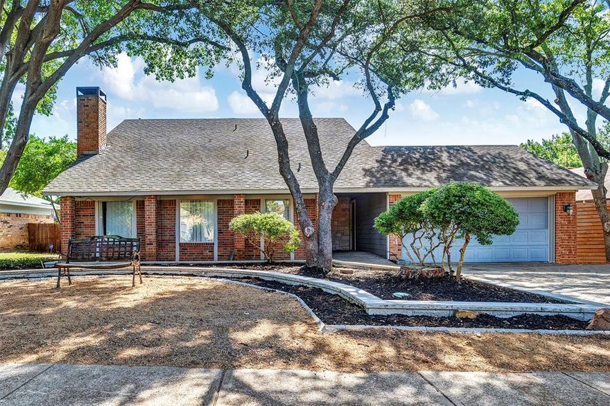 Nestled in the highly sought-after Palos Verdes Estates in Mesquite, surrounded by mature trees, this charming 3 bedroom home offers over 2,200 square feet of meticulously maintained living space. *Roof shingles and decking will be replaced at the home before closing* Upon entry, guests are greeted by a vaulted ceiling in a formal living area, complemented by wood floors, a wood burning fireplace and archways that open into a formal dining room. A wet bar is ideally situated off the dining room for entertaining. The kitchen boasts a breakfast bar, custom soft-close cabinets, granite countertops, stainless steel appliances, and not one but two pantries, including a walk-in option with pull-out drawers. The adjacent family room, with its built-ins and double doors, opens up to the backyard patio. The primary suite features wood floors, a see-through fireplace, office space, and a lavish bathroom with an oversized walk-in shower and multiple shower heads. Additional bedrooms offer versatility, with one currently serving as an office complete with a Murphy Bed and custom built ins. Enjoy a large patio outside and a professional sprinkler systems for the entire yard. Storage is abundant, including a spacious storage closet off the patio and two additional storage garages. Conveniently located near major highways, shopping at Town East Mall, and Lake Ray Hubbard, this home is ideal for those seeking comfort and convenience.