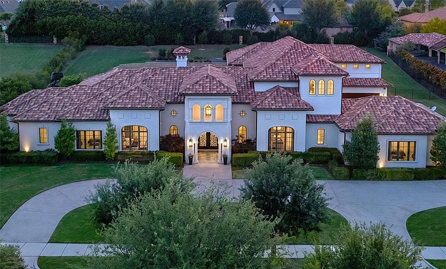 A rare opportunity to own a magnificent Santa Barbara-inspired Mediterranean estate nestled within the exclusive gated community of Estates of Craig Ranch. Reminiscent of the finest California coastal estates, poised on over an acre, this estate delivers a lifestyle unlike any other - including a one-time transferable TPC Craig Ranch golf membership valued at $150K, allowing the new owner to completely bypass the coveted waitlist and step directly into premier golf living.
At 7,271 sq ft, the floor plan is exceptional and increasingly hard to find: 3 bedrooms down, 2 up - one with a generous sitting room, spread across 4 expansive living areas including a first floor theater, designed for both grand entertaining and comfortable everyday living. Three custom iron doors in the main living room dissolve the boundary between indoors and out, opening seamlessly to multiple sprawling main floor verandas, resort-style pool and the expansive outdoor living center-kitchen-grill area. Directly above, a second large balcony overlooks the same breathtaking setting, delivering a true indoor-outdoor experience on both levels. A dedicated media theater off the family room, a hidden extra large additional flex space-gym, an oversized walk-in pantry, and a reinforced hidden safe room round out a home as thoughtfully functional as it is stunning.
The primary suite is a true sanctuary with his and hers oversized closets, dual commodes, a steam shower, and a freestanding soaking tub. The 4-car garage features EV charging stations with additional guest parking. The sprawling acre-plus lot leaves room for a future tennis or sport court. A lifestyle of luxury, privacy, and unrivaled golf living, effortlessly delivered.