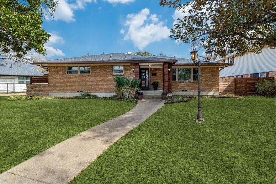 This beautifully updated ranch-style home seamlessly blends classic mid-century modern architecture with today’s most sought-after finishes, all in an exceptional location near White Rock Lake and the Dallas Arboretum and Botanical Garden. Offering 3 bedrooms and 2.1 bathrooms, the thoughtfully designed floorplan balances style and functionality. The private primary suite is a true retreat, featuring an ensuite bath with dual sinks, a separate shower, and a convenient Hollywood bath layout. Two secondary bedrooms share a Jack-and-Jill bath with dual sinks—ideal for family or guests. The renovated kitchen and bathrooms shine with modern finishes, while wood floors flow throughout. Step outside to a large, fenced, and professionally landscaped backyard, perfect for entertaining, relaxing, or gardening. A 2-car garage plus a 2-car carport ensures ample parking and storage. With its clean lines, open flow, and refined updates, this mid-century modern ranch delivers timeless character, everyday comfort, and an unbeatable location.