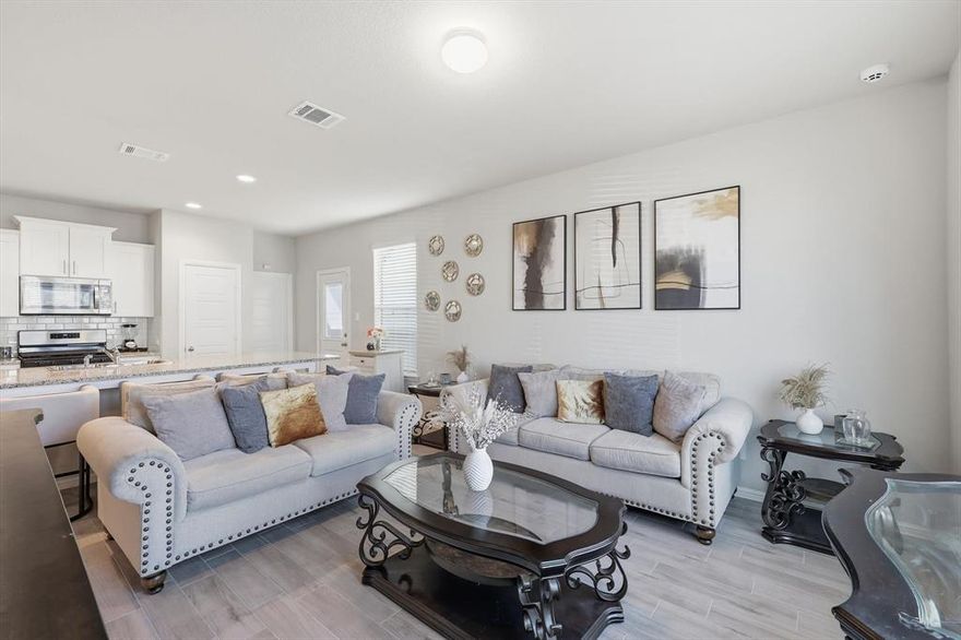 Welcome to this beautifully designed 3-bedroom, 2.5-bath townhome offering 1,590 sq ft of modern living in a gated community. Built in 2024, this home combines contemporary finishes with a smart layout that makes everyday living both comfortable and stylish.

Step inside to discover ceramic plank tile flooring throughout the main level, creating a sleek and low-maintenance foundation for the open-concept living space. The kitchen is truly the centerpiece of the home, featuring a large statement island, gas range, and generous counter space—perfect for cooking, gathering, and entertaining.

Upstairs, a versatile loft area provides additional living space that can easily serve as a home office, media nook, or kids’ play area. The spacious primary suite offers a relaxing retreat, complete with a large walk-in closet and a beautifully finished bathroom featuring double vanities and a subway-tiled glass shower.

Two additional bedrooms provide flexibility for guests, family members, or workspace needs.

Enjoy the peace and privacy of gated community living while still being conveniently located near shopping, dining.