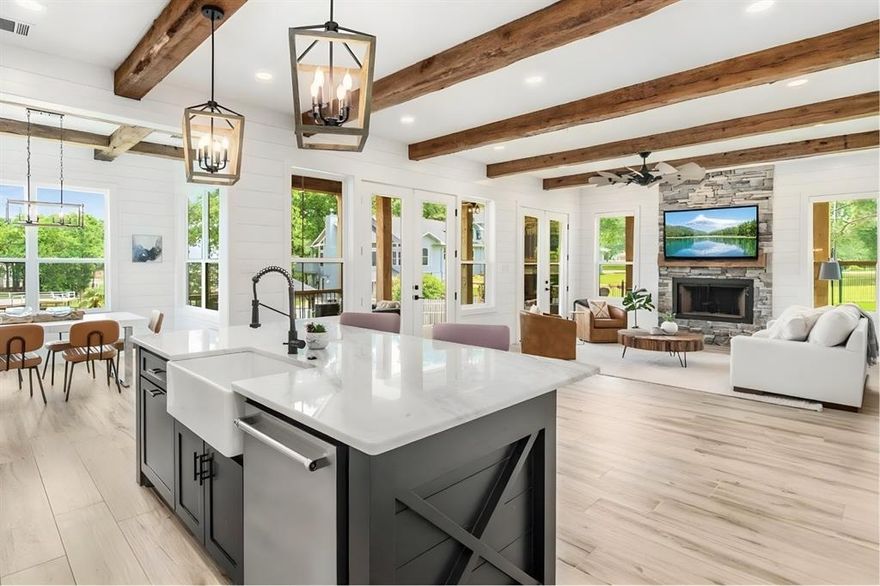 If you’ve been waiting for the right lake house—this is it. Elevated above Cedar Creek Lake with sweeping open water views, this modern farmhouse delivers the rare combination of newer construction, thoughtful design, and true lake lifestyle just over an hour from Dallas.

Built in 2021, the home offers 5 bedrooms, 5.5 baths, and approximately 4,488 square feet designed for both everyday living and large gatherings. The open-concept main level features warm wood beams, shiplap accents, a floor-to-ceiling stone fireplace, and walls of windows that bring the lake into every moment. The chef’s kitchen is built to entertain with quartz countertops, an oversized island, premium appliances, bar closet, and walk-in pantry.

The primary suite is a private retreat with private patio and water views, while a main-floor study easily functions as a guest suite. Upstairs, two generous guest bedrooms with en-suite baths and a dedicated recreation wing with built-in bunks, game room, full bath, and additional bedroom create the perfect setup for hosting family and friends.

Outdoor living takes center stage with a wraparound covered porch, porch swings, outdoor fireplace, and grilling area overlooking the water. The fenced yard slopes to a private boathouse featuring a 25-foot slip, dual jet ski lifts, and a sunken party deck—designed for long weekends and sunset evenings.

Located in Arnold Hills with access to a pickleball court and private boat ramp, this is more than a home—it’s the lake lifestyle buyers are searching for.