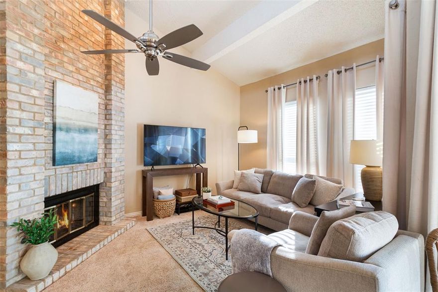 Perfect for students, professionals, or anyone seeking low-maintenance living in a prime location! This beautifully refreshed 2-bedroom, 1-bath condo offers a smart, functional layout with stylish updates throughout. The private oversized garage is located on the first level with interior stair access leading directly to the condo on the second floor, plus an additional assigned exterior parking space. The garage also features built-in storage shelving for added convenience. As you come upstairs from the garage, the updated kitchen welcomes you on the right with recent appliances, a breakfast bar, and a charming interior opening that overlooks the living space, perfect for staying connected while cooking. The refrigerator is recently updated and included with the home. Just across from the kitchen is a dedicated laundry room with an updated washer and dryer. Straight ahead, the living room is warm and inviting with a beautiful brick fireplace and fresh paint throughout. The dining area is perfectly positioned near the living space, creating an open and comfortable setting with great flow for hosting and everyday living. Down the hall, the bathroom features unique decorative tile and a tub-shower combo. The spacious primary bedroom offers a walk-in closet, while the second bedroom is well-sized and versatile, ideal for a roommate, guest room, or home office. Outside, enjoy beautifully landscaped grounds with a scenic walking path leading to the condo, community mailboxes, and a sparkling community pool. Located just minutes from the Silver Line with quick access to the airport and a nearby UTD shuttle stop, this is an unbeatable location for students and commuters alike. This CANNOT be bought as an investment property - the HOA's lease property limitations are at capacity.