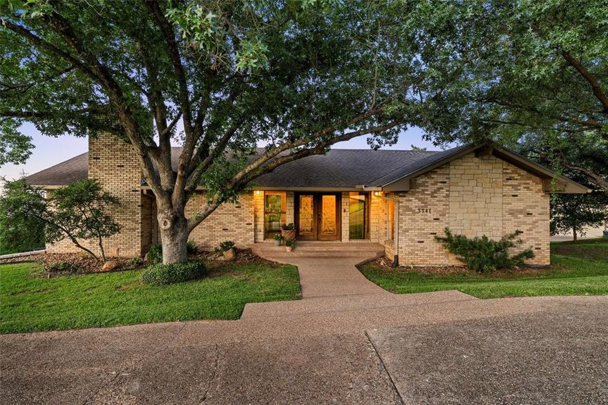 Welcome home to 3341 North Ridge Drive, where breathtaking panoramic lake views await you. Nestled in one of Waco’s most tight-knit communities, this stunning residence is surrounded by beautiful hills and some of the finest homes in the area, creating a picturesque setting that truly enhances your living experience. Set on a generous lot of just under an acre, you will find yourself enveloped by mature oak trees, with serene views of both a charming pond and the tranquil waters of Lake Waco. This impressive 5-bedroom, 3-full-bathroom home boasts ample space, featuring three expansive living areas, including a dedicated movie theater room, perfect for family gatherings or entertaining friends. The primary bedroom provides a unique tree-like ambiance, accented by French doors that open directly onto your outdoor patio, allowing you to indulge in lake views just steps from your bed. Each of the generously sized bedrooms ensures comfort and privacy for all family members or guests. For those who love to entertain, imagine preparing meals in the kitchen while enjoying stunning views of the lake through your window, or basking in the natural light streaming through the floor-to-ceiling windows in the living room. The combination of a wet bar and a covered patio on the lower level also creates an inviting atmosphere for hosting gatherings. 

This is not just a house; it’s an opportunity to embrace a lifestyle defined by beauty, comfort, and community. Don’t let this chance slip away—your dream home awaits.