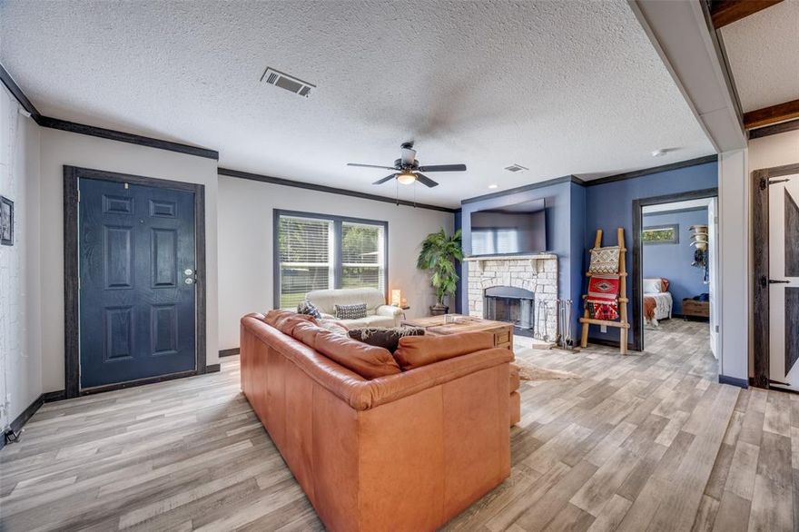 HUGE PRICE IMPROVEMENT! Welcome to your very own 6-acre equestrian retreat, a property with history, heart, and everything needed to create the lifestyle you’ve been dreaming of. Once home to a respected cutting horse training operation, this ranch is perfectly set up for horse enthusiasts and cattle work alike and ready to be restored to its former glory. 10-stall post-frame barn, hydraulic hot walker, mechanical flag, automatic pasture waterer, holding pens, and smartly designed layout make caring for animals and moving cattle from pasture to arena both efficient and enjoyable. A two-stall loafing shed doubles as tack storage and a welcoming spot to meet clients. The bunkhouse—with shower, sink, toilet, and washer-dryer connections—are ready for guests, visitors, or easy add-on conversion to private living quarters for additional income. Also available on-site is two RV spots, one located near the bunkhouse with 30amp hookup and the other with brand new 50 amp electrical located on the south side of the barn. 
The property welcomes you with a picturesque entry and continues to impress with a stunning 2023 Palm Harbor manufactured home with permanant slab foundation. This home blends modern comfort with rustic charm. Step inside to an open-concept floorplan anchored by a cozy wood-burning fireplace, a chef’s island with farmhouse sink, wine fridge, and spaces designed for entertaining. The primary suite offers a spa-like walk-in shower and generous closet space, while two additional bedrooms, a full bath, and a flexible second living area—currently used as an office—round out the thoughtful design.
Whether you’re dreaming of running your own equestrian business, creating a family homestead, or simply enjoying wide-open spaces, this well-appointed property is ready to deliver the lifestyle you’ve always imagined.