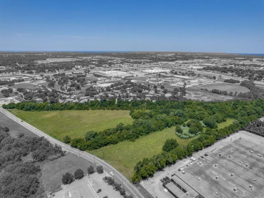 This exceptional 15.125 acre Development Site within an OPPORTUNITY ZONE, in Sherman, TX is zoned MF-30 and fully approved by the City for a 300-unit multifamily community. A rare, shovel-ready opportunity, the property consists of four contiguous parcels with all utilities available. Ideal for high-density multifamily, build-to-rent (BTR), townhomes, or duplexes, or would make a great affordable housing site. The mostly flat topography is lined with mature trees for privacy, and a narrow floodplain separates the site, making it ideal for blending multiple product types or developing a unified large-scale complex. Survey, Topo, Phase I Environmental reports, and a conceptual engineering MF and Townhome Site Plan. Located only a half mile from US-75 and US-82, this premier site offers exceptional access, visibility, and long-term growth potential. Ag Exempt.