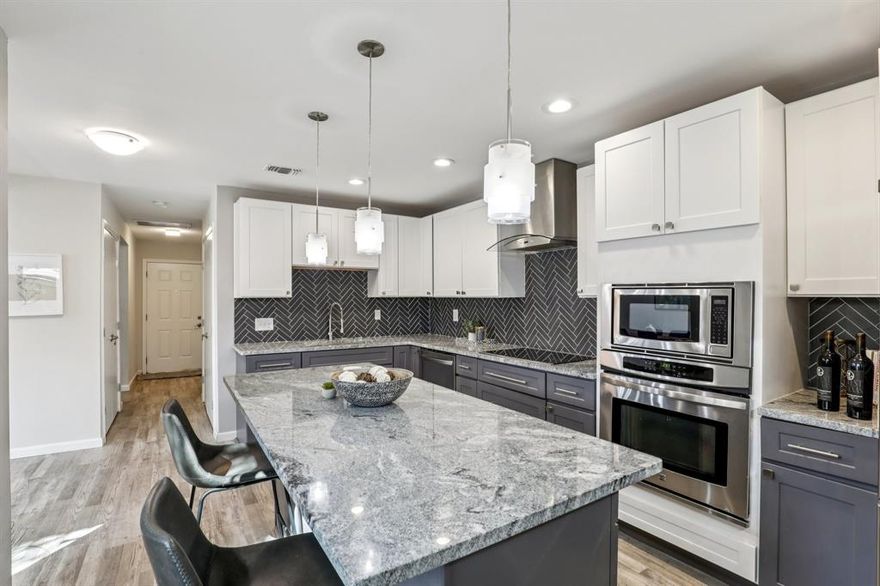 Living here means embracing a lock-and-leave lifestyle with less exterior maintenance and more time to enjoy the things you love. This one-of-a-kind Gem is the largest floorplan in the community! 1,651 sq ft, 3 bedrooms and 2.5 baths! As you arrive, a majestic oak tree creates a welcoming first impression, providing abundant shade and a picturesque view from the primary bedroom.  The inviting living area is spacious and seamlessly flows from living to dining - then to the eat-in kitchen.  Downstairs features tasteful designer lighting and new flooring throughout.  KITCHEN: The thoughtfully remodeled kitchen is a chef’s delight with sleek stainless-steel appliances, plenty of cabinets, and a large island creating an eat-in kitchen.  UPSTAIRS - PRIMARY SUITE: The tranquil primary suite provides great natural light from the double window;  shower with Bathtub, dual sinks and large walk-in closet. The 2nd and 3rd bedrooms are very good-sized secondary bedrooms.  Both bedrooms have double windows for good natural light, and one bedroom has a walk-in closet.  Full bathroom with walk-in shower located in the hall. OUTDOOR LIVING SPACE: Step outside to your oversized private patio, perfect for entertaining, relaxing, or enjoying your morning coffee.  Residents also enjoy access to wonderful community amenities, including two neighborhood swimming pools, making it easy to unwind and connect with neighbors. This central Dallas location offers quick access to Central Expressway (US-75), I-635 LBJ Freeway, the Dallas North Tollway, and I-35. UPDATES 2023 to CURRENT: MECHANICAL UPGRADES: New AC System, new water-heater, new electric panel, new electrical wiring throughout the home, new plumbing in kitchen and half bath.  KITCHEN REMODEL: New countertops, new cabinets, new Sink, new disposal, new over-sized island. ADDITIONAL UPGRADES: New floors downstairs, new backdoor, new back windows, new designer lighting