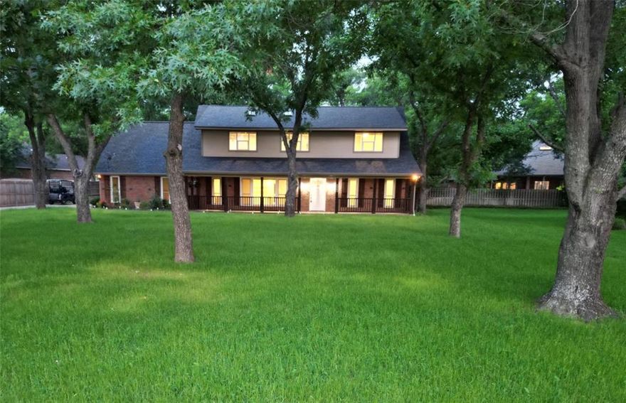 Beautifully renovated 4-bedroom, 3.5-bath home in the highly sought-after Pecan Plantation Country Club, offering 2,700 sq ft of living space with two spacious living areas, a large dining area, and a cozy wood-burning fireplace. Situated on a quiet, landscaped cul-de-sac lot with several mature pecan trees, this home features granite countertops, custom cabinetry, a whole-house vacuum system, intercom, and a luxurious primary suite with a freestanding tub, separate shower, and generous walk-in closet. Two refrigerators, washer, and dryer will convey. Recent upgrades include new windows (2017), new HVAC system (2022), and a durable Class 4 roof (2022). Move-in ready and filled with comfort, style, and modern functionality.