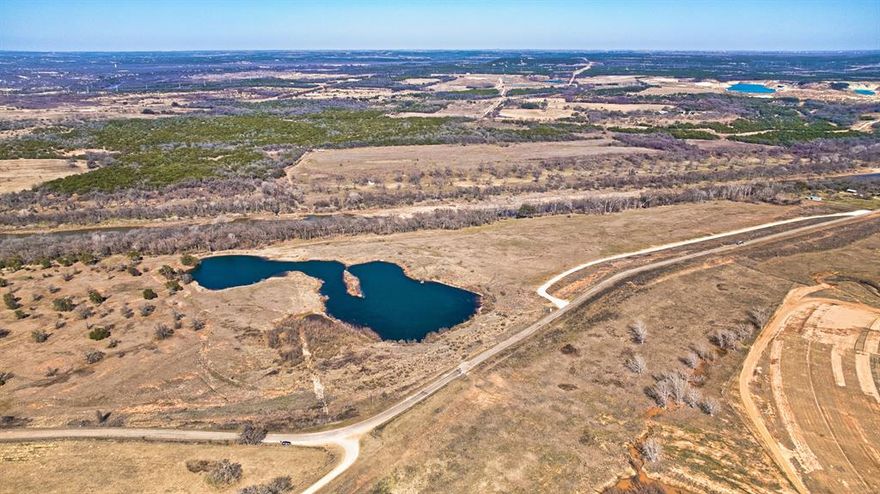 Welcome Home to the Premier Brazos River Ranch Subdivision located in Granbury! 16 total lots spanning almost 100 acres and we have already presold 4 of them. Lot 8 is just over 6.6 acres and available. A majority of these parcels have exclusive access and back up the the Brazos River - Perfect to build your retirement and dream home on or purchase as an investment and watch the value appreciate. There is water available by well and there is electricity available at the road on each parcel. Each of these lots are also COMPLETELY UNRESTRICTED. Seller financing is also available - See MLS Transaction desk for specific terms. Only an hour and a half from Dallas and 1 hour from South Fort Worth these make an amazing weekend getaway. Survey is also available. Make an offer before someone else does!