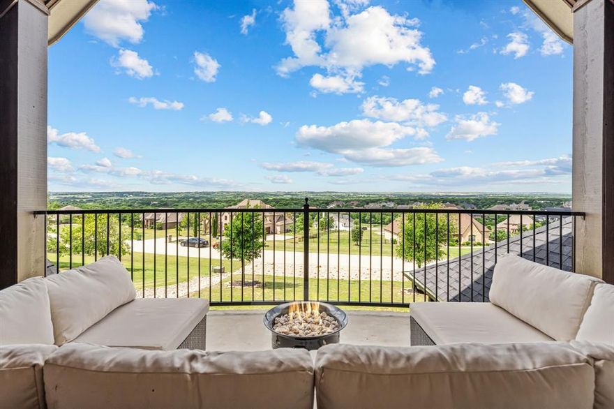 Perched high above the surrounding landscape, this one-of-a-kind custom home captures breathtaking panoramic views from one of the most scenic hilltop settings in the guarded and gated Bella Flora community in Aledo ISD—truly reminiscent of Texas Hill Country living. From sunrise to sunset, enjoy miles of uninterrupted skyline and an elevated vantage point that makes this property exceptionally rare.
Thoughtfully designed for both everyday living and entertaining, the first floor features a spacious primary suite, private guest bedroom, dedicated office, formal dining room, and an open-concept kitchen, breakfast area, and living room—all positioned to maximize natural light and showcase the incredible views. A dry bar and butler’s pantry with a mini refrigerator seamlessly connect the dining room and kitchen, adding both functionality and effortless flow for entertaining.
Upstairs offers two additional bedrooms connected by a Jack-and-Jill bath, a media room, half bath, and a versatile loft-style living area with glass doors opening to a west-facing balcony where you’ll experience unforgettable Texas sunsets and sweeping views for miles.
Designed as a private outdoor retreat, the backyard features a sparkling pool with tanning ledge and bubblers, attached spa, stone waterfall, covered patio with fireplace, and a detached pergola with built-in grill—creating multiple spaces to relax, unwind, or entertain beneath the expansive Texas sky.
Additional interior highlights include hardwood, tile, and carpet flooring, plantation shutters, Cat5 wiring, three zoned HVAC systems, two tankless water heaters, a water storage tank, and two separate garages accommodating up to four vehicles. A new high-impact roof and gutters were installed in May 2025.
A rare opportunity to own a true hilltop property with unmatched views in Bella Flora.