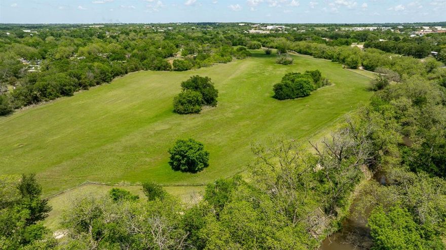 Discover an exceptional investment opportunity with this expansive 24.8-acre parcel, ideally situated within the city limits. This unique property boasts the rare advantage of being bordered by the ever so popular Bosque River Walking Trail, offering a blend of natural beauty and urban convenience. Zoned B-3 Central Business, the land presents a wide array of development possibilities, limited only by your imagination. The location is perfect for constructing high-density apartments to meet the growing demands, or you could develop a housing community that attracts residents. With direct access to the walking trail and the river, future residents will enjoy outdoor activities right at their doorstep, enhancing the property's appeal and value. Investing in this property means capitalizing on a prime location with flexible zoning, promising substantial returns. The combination of natural amenities, accessibility, and central business zoning makes this an unparalleled opportunity to shape a significant part of the city's future. Don't miss out on the chance to transform this land into a thriving residential or commercial hub.