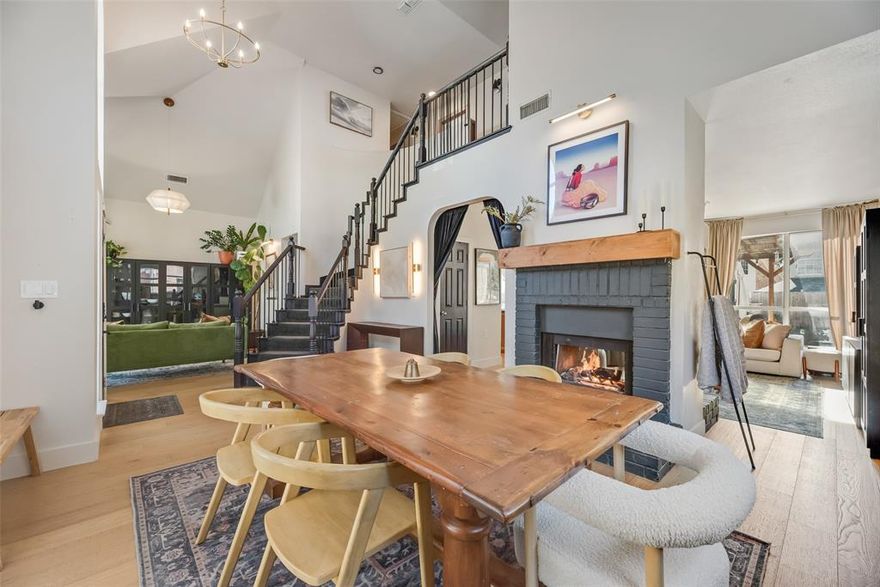 Welcome to this beautifully updated and impeccably designed home, where timeless architecture meets modern style in Stonebridge Ranch! From the moment you arrive, you are greeted with a great curb appeal with Romabio organic lime white wash exterior, arched front windows, and mature trees. Immediately when you walk in, you will notice a curved staircase, with a two story foyer. The double-sided cozy fireplace really makes a statement; it adds so much charm and character immediately when you walk in. Half bath has gorgeous designed wallpaper, and it is definitely one of a kind with lots of charm. The chef-inspired kitchen is definitely the center point of the home. It features the waterfall Vicostone quartz countertop, solid wood custom cabinets featuring soft close doors and drawers, 5 burner gas cooktop, double ovens, and built-ins for extra storage.  Wander upstairs, to the right with the double doors, this space can be used as a bedroom or is currently functioning as an office with lots of windows. The primary bedroom is spacious with gorgeous wood beams, and the primary bath features double vanity, updated Dream Line French Corner Framed Sliding Shower, and a free standing Acrylic Soaking Tub. The living spaces continue the home’s polished aesthetic, showcasing white oak water resistant flooring, elegant lighting and the expansive windows make the home feel open and bright. The landscaped backyard has an awning with an extended patio. Located in Stonebridge Ranch with access to premier amenities including scenic lakes, trails, parks, tennis, beach club, and community pools. Minutes from top schools, shopping, dining, and major commuter routes.