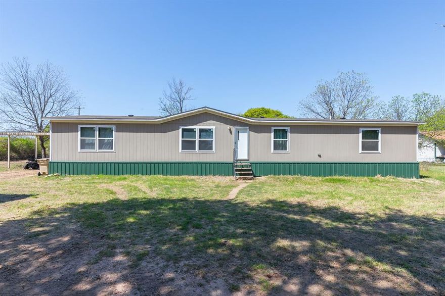 Spacious and nearly new 4 bedroom, 2 bath doublewide mobile home built in 2022, situated on approximately 1 acre. Enjoy peaceful country style living with the convenience of being just 2 miles from the grocery store, fast food and restaurants in Clyde. The property features mature pecan trees and a water well, with plenty of room for outdoor living. The land responds well to watering, offering great potential for a lush yard or garden. Nature lovers will appreciate the frequent visits from deer and a variety of birds that pass through the property. A perfect blend of quiet rural charm and close to town accessibility!